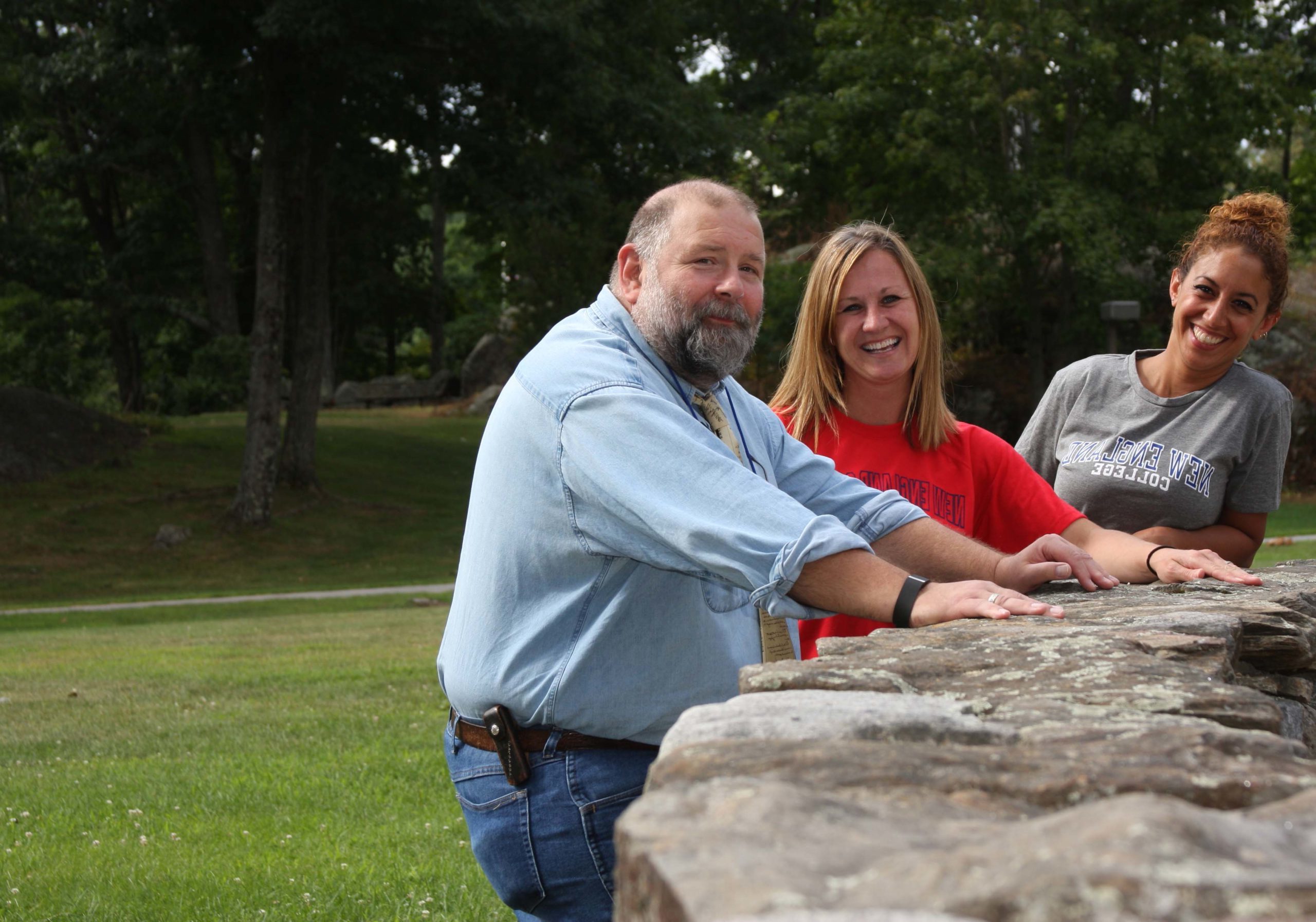 Three undergraduate faculty members outside in Henniker