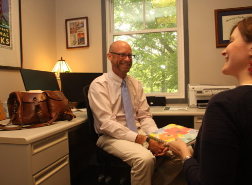 Professor Gavin Henning meets with a student