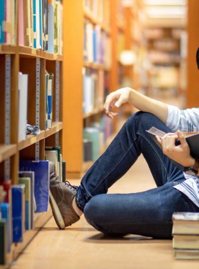 Student reading in a library