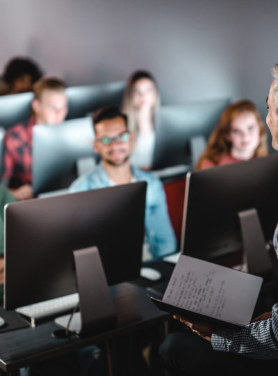 Teacher addresses students in a classroom