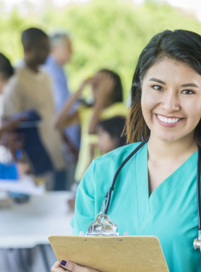 Nurse smiles at the camera