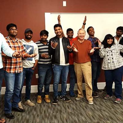 International students pose with faculty member Rick Mitchell