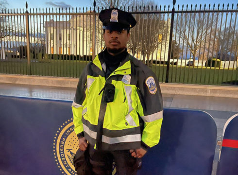 Criminal Justice alumni Sean McDowell stands guard in front of the United States Capitol