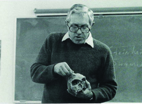 Former Anthropology professor Michael Wireman holding a skull