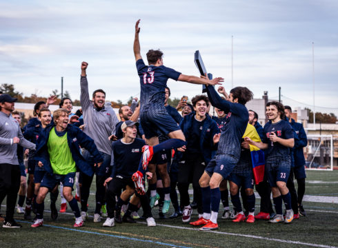 NEC men's soccer team celebrates their championship victory