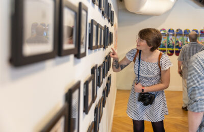 Guest admires artwork at the 2022 BFA Annual Exhibition