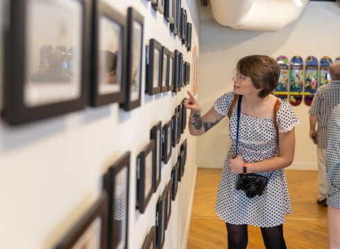 Guest admires artwork at the 2022 BFA Annual Exhibition