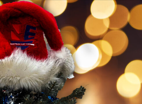 Photo of Christmas tree with ornament and Santa hat with NEC logo