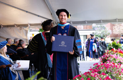 Student receives his doctorate degree in Education from New England College in Henniker, NH.