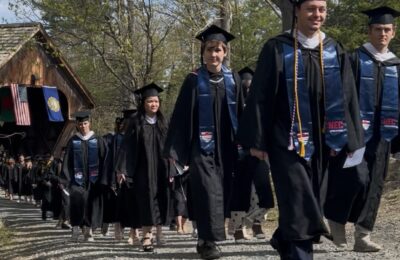 Students proceed into the Commencement ceremony at New England College on May 2, 2025.