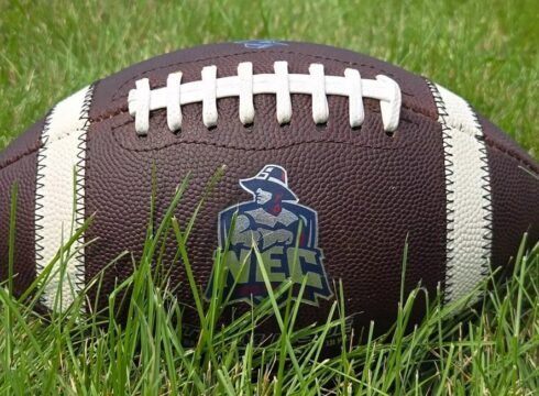 Image of a football with the New England College logo