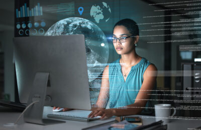 AI strategist works at a computer.