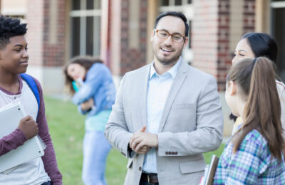 School principal interacts with students