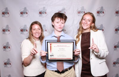 Professor Colleen McElveen and students Soob Soobitsky and Lauren Hall attend the 2026 New England Newspaper & Press Association awards on March 14.