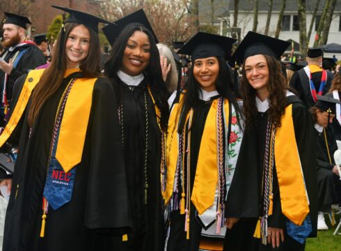 Four graduating students at New England College's Commencement ceremony on May 2, 2026