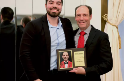 Assistant Director of Athletics Geoffrey Hassard receives the Pete Nevins Award for Distinguished Service by the Eastern Athletic Communications Association – EAST-COMM (formerly ECAC-SIDA).